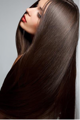 Model with long, glossy straightened brunette hair