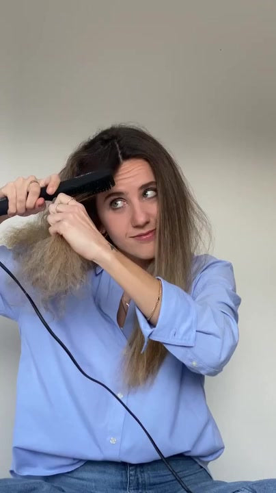 Straightening a section with the TNS Straightening Brush instead of a flat iron