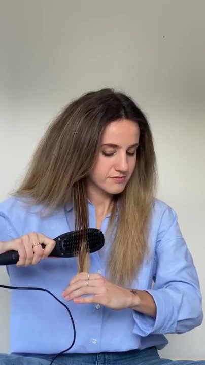 Brushing hair straight with the TNS Straightening Brush